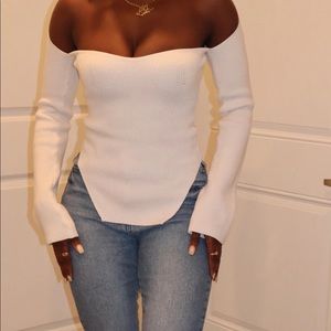 Off white sweater. Off the shoulder/sweetheart neckline. Never worn.
